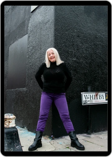 Little Nerd Web Design - Louise Foster - leaning against a black concrete wall